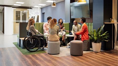 People at work gathering around a table