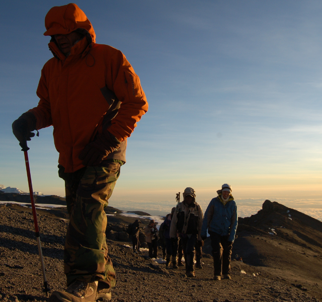 Walkers trekking up Kilimanjaro