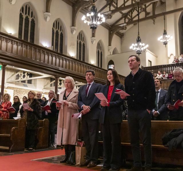 congregation of the church singing carols