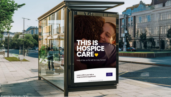 A bus stop showing a poster which reads This is Hospice Care